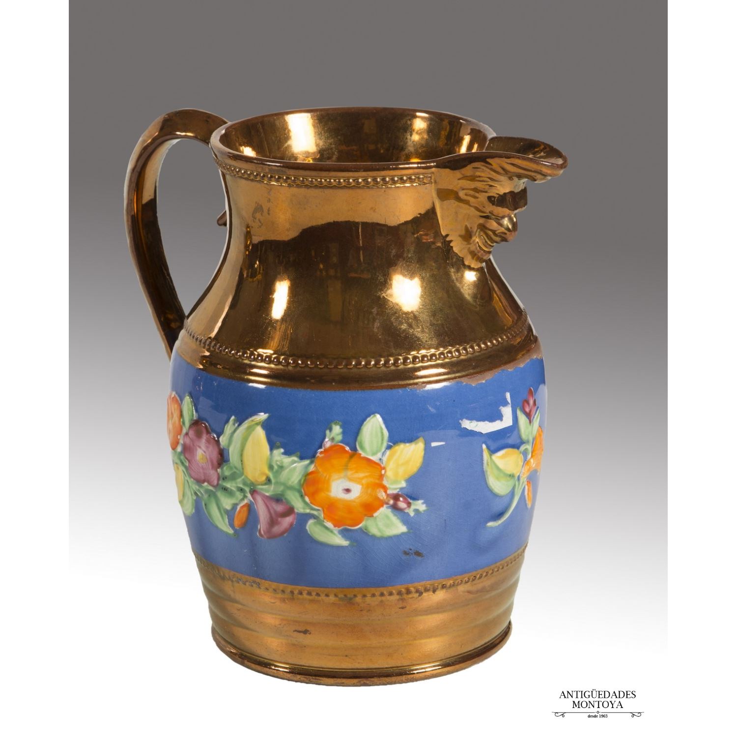 Enameled ceramic jug in golden reflection of B ...